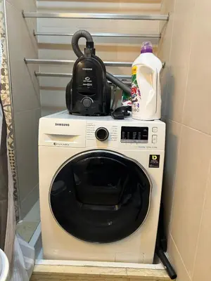 a washing machine with a kettle on top of it at Casablanca ANFA Apartment in Casablanca