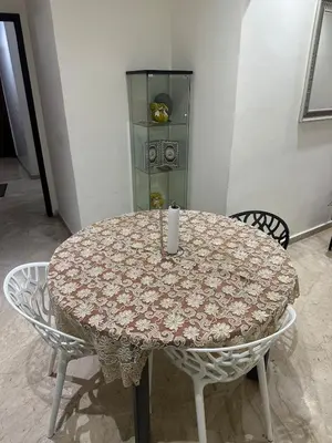 a table with a candle sitting on top of it at Casablanca ANFA Apartment in Casablanca
