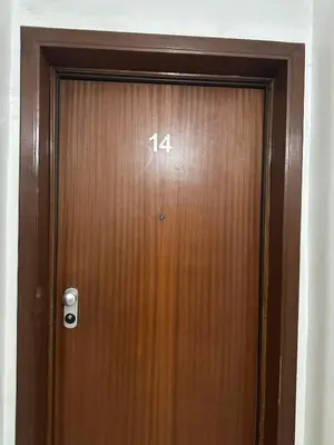 a wooden door with the number on it at Casablanca ANFA Apartment in Casablanca