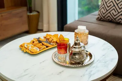 a table with a tray of food on a table at Suite Cosy Moderne Chic Calme Jardin and Habous in Casablanca