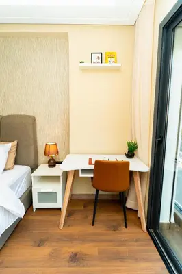 a bedroom with a desk and a bed at Suite Cosy Moderne Chic Calme Jardin and Habous in Casablanca