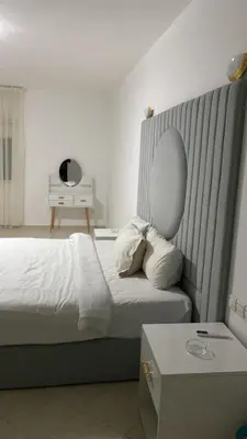 a hotel room with a bed and a mirror at Big Villa In Rabat in Rabat