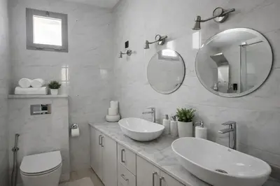 a white bathroom with two sinks and a mirror at Spacious 3 Bedroom Apartment in Rabat Near Moulay El Hassan Stadium Malls and Embassies in Rabat