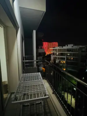 a balcony with a bed on top of a building at Granada in Rabat