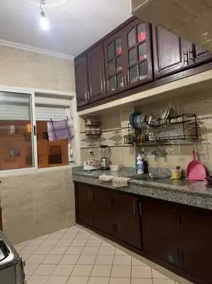 a kitchen with a sink and a counter top at Halimadriss in Rabat
