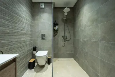 a bathroom with a shower and a toilet at Casablanca Panorama Apartment in Casablanca