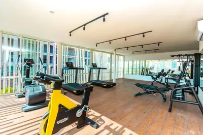 a gym with several treadmills and exercise bikes at Central Studio CFC I Gym I Pool in Casablanca