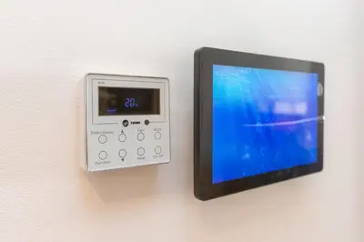 a remote control is attached to a wall at Cosy Flat for Business Trip at CFC - Infinity Pool in Casablanca