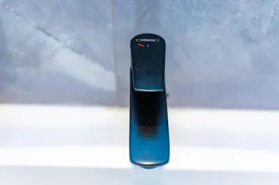 a black remote control sitting on a table at Cosy Flat for Business Trip at CFC - Infinity Pool in Casablanca