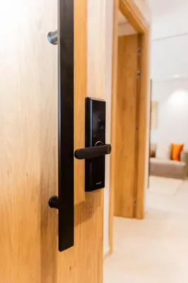 a black door handle on a wooden door at M Studio cosy princesses in Casablanca