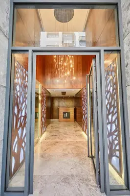 an empty hallway with a chandelier in a building at Luxueux Appartement Sécurisé in Casablanca