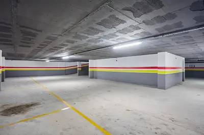 an empty parking garage with red yellow and white walls at Luxueux Appartement Sécurisé in Casablanca