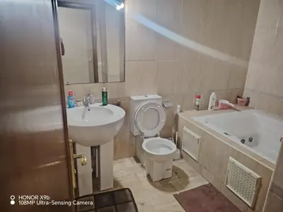 a bathroom with a sink and a toilet and a tub at Appartement 2 mars in Casablanca