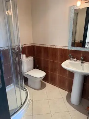 a bathroom with a toilet and a sink and a shower at VILLA BOUSKOURA Casablanca in Casablanca