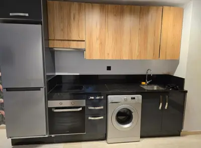 a kitchen with a washing machine and a washer at CASA Opal - Downtown Luxury Homes in Casablanca