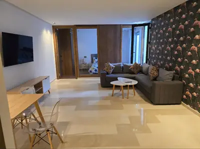 a living room with a couch and a table at CASA Opal - Downtown Luxury Homes in Casablanca