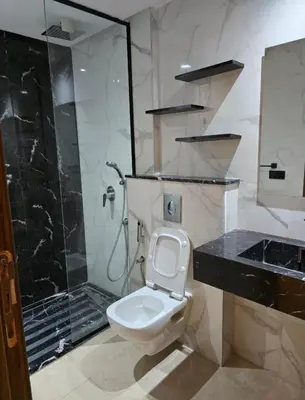 a bathroom with a shower and a toilet and a sink at CASA Opal - Downtown Luxury Homes in Casablanca