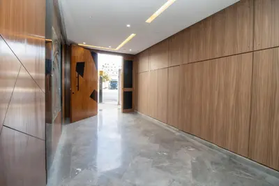 a hallway with wood paneled walls and a long hallway at Magnificent apartment 2 in Casablanca