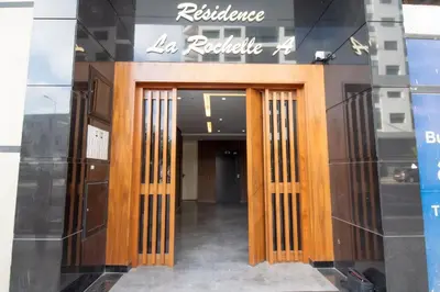 a store front of a building with wooden doors at Magnificent apartment 2 in Casablanca