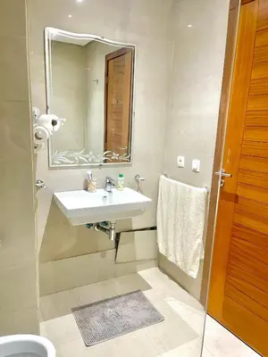 a bathroom with a sink and a mirror at Taj collection 1 in Casablanca