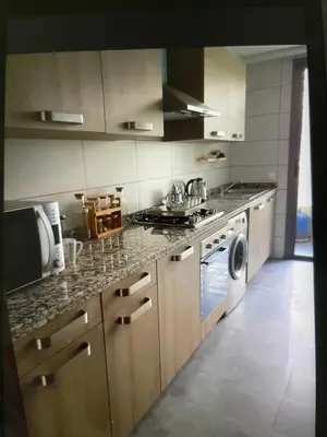 a kitchen with a stove and a dishwasher at Taj collection 1 in Casablanca