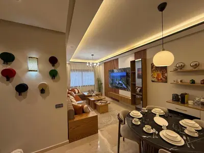 a living room with a dining table and a couch at Sanctuaire Soleil & Luxe Casablanca in Casablanca