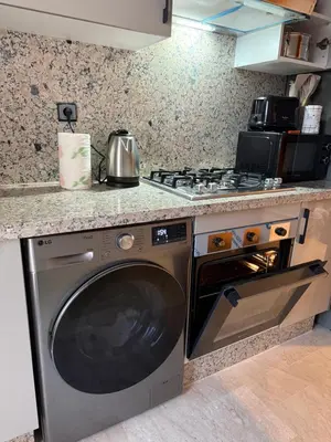 a kitchen with a stove and a dishwasher at Sanctuaire Soleil & Luxe Casablanca in Casablanca