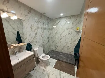 a bathroom with a toilet and a sink at Sanctuaire Soleil & Luxe Casablanca in Casablanca