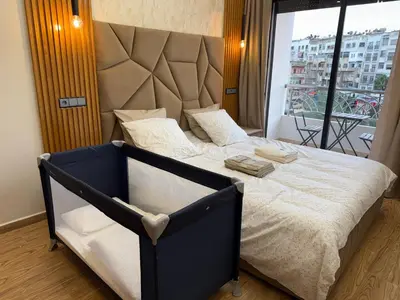 a bedroom with a large bed with a large window at Sanctuaire Soleil & Luxe Casablanca in Casablanca
