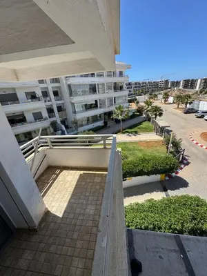 a balcony of a building with a building at Luxury apartments in Mansouria