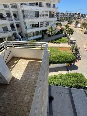 a view of a building from the balcony of a building at Luxury apartments in Mansouria