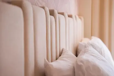 a row of white curtains on a wall at Luxurious 2BR 2BA For Families and groups in Casablanca