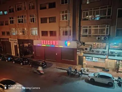 a car parked in front of a building at night at Apparttement BOUCHRA in Casablanca