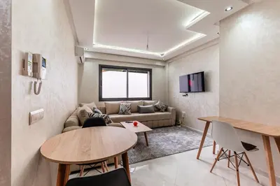 a living room with a couch and a table at Contemporary Hideaway Design and Tranquility in Casablanca