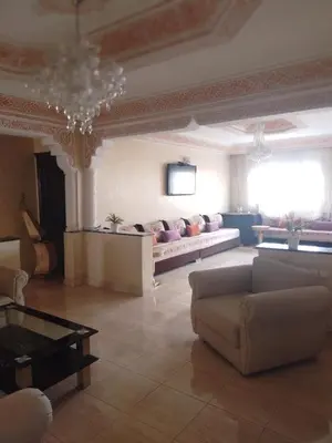 a living room with a couch and a table at Joli appartement bien équipé-Casablanca in Casablanca