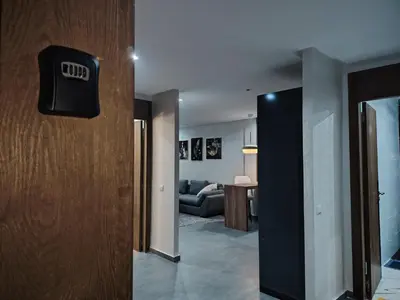 a hallway with a door and a living room at Un studio luxueux au centre de Casablanca in Casablanca
