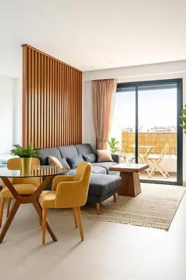 a living room with a couch and a table at superbe loft au cœur de la ville in Casablanca