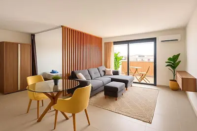 a living room with a couch and a table at superbe loft au cœur de la ville in Casablanca