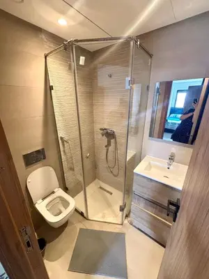 a bathroom with a shower and a toilet and a sink at superbe loft au cœur de la ville in Casablanca