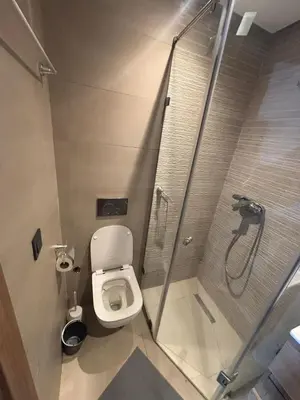 a small bathroom with a shower and a toilet at superbe loft au cœur de la ville in Casablanca