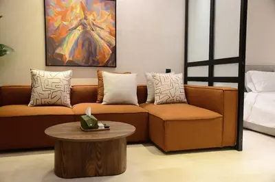 a living room with a couch and a table at Socrates Prestige, quartier Les Princesses in Casablanca