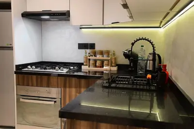 a kitchen with a stove and a counter top at Socrates Prestige, quartier Les Princesses in Casablanca