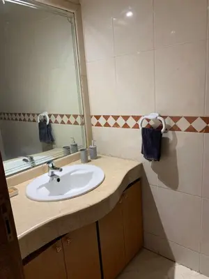 a bathroom with a sink and a mirror at Casablanca Stay in Casablanca