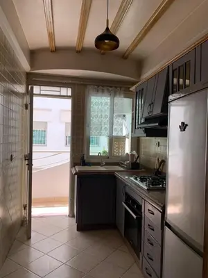 a kitchen with a white refrigerator and a sink at Casablanca Stay in Casablanca