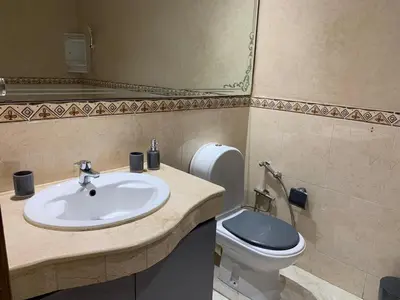 a bathroom with a sink and a toilet at Casablanca Stay in Casablanca