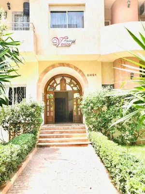 a building with a staircase leading to a door at Venezia apartment with 2 Large Bedrooms 3 Beds in Mohammedia