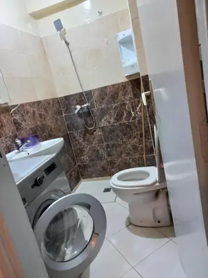 a small bathroom with a toilet and a sink at IDY HOME's in Casablanca