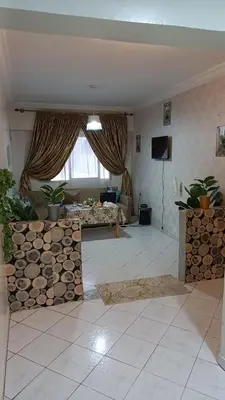 a living room with a couch and a table at IDY HOME's in Casablanca
