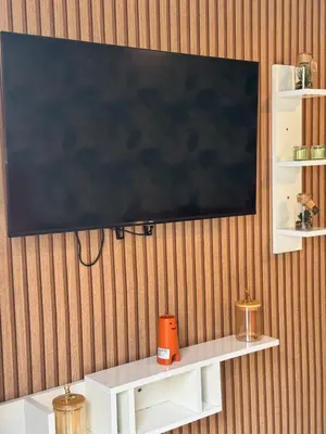 a flat screen tv hanging on a wall at Elegant studio with large terrace in Rabat