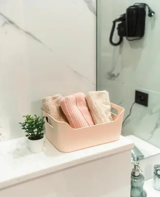 a pink towel holder sitting on a shelf in a bathroom at residence living housse in Casablanca